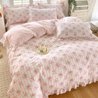 Cozy queen size duvet set featuring a soft cotton fabric with a delicate pink floral pattern and charming ruffles, perfect for adding a touch of elegance to 0