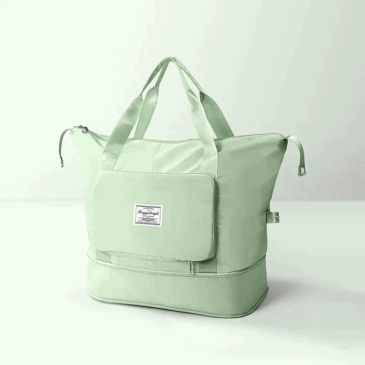 Foldable travel bag for women in vibrant teal, made from durable polyester. Features spacious interior, sturdy handles, and convenient foldable design for easy storage 6