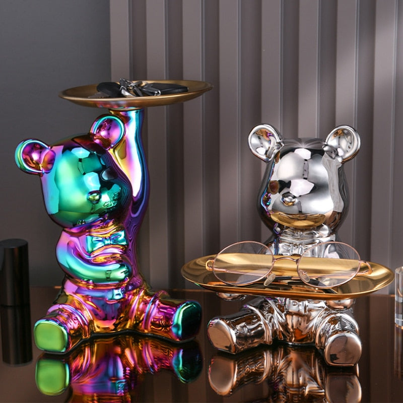 Adorable galvanized piggy bank featuring a bear doll shelf, perfect for saving coins. The shiny silver finish adds a playful touch to any room, making 1