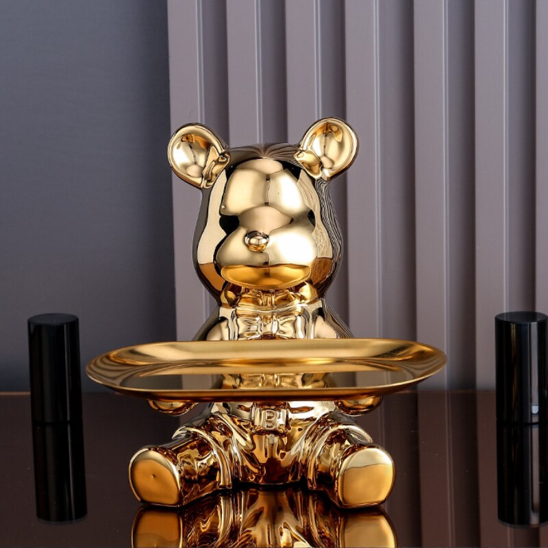 Adorable galvanized piggy bank featuring a bear doll shelf, perfect for saving coins. The shiny silver finish adds a playful touch to any room, making 13