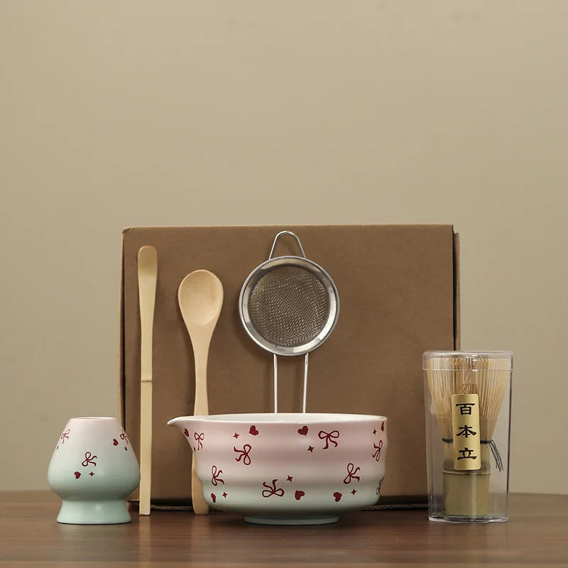 Hand-painted matcha tea set featuring a beautifully crafted bowl and whisk. The set showcases an elegant aesthetic with delicate floral designs in soft green and cream colors 0