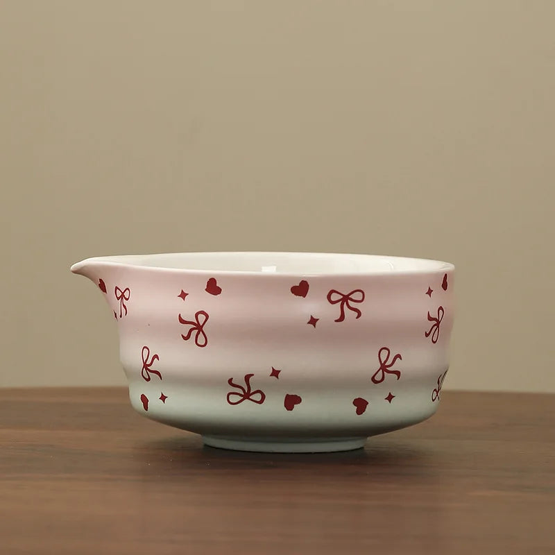 Hand-painted matcha tea set featuring a beautifully crafted bowl and whisk. The set showcases an elegant aesthetic with delicate floral designs in soft green and cream colors 10