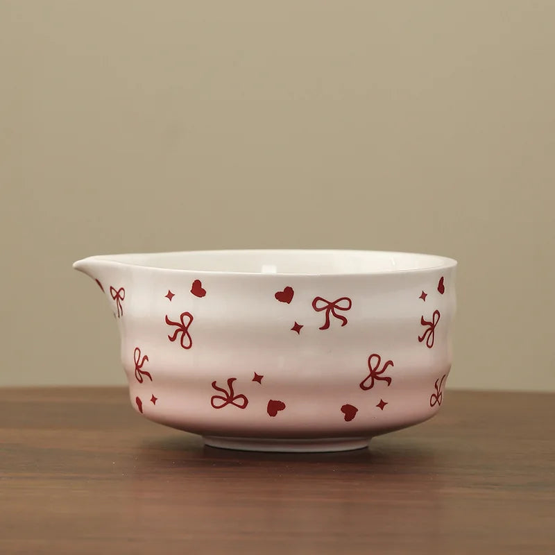 Hand-painted matcha tea set featuring a beautifully crafted bowl and whisk. The set showcases an elegant aesthetic with delicate floral designs in soft green and cream colors 12