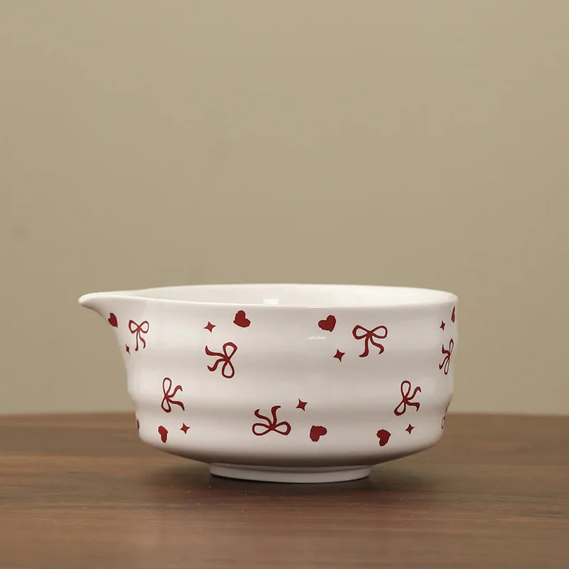 Hand-painted matcha tea set featuring a beautifully crafted bowl and whisk. The set showcases an elegant aesthetic with delicate floral designs in soft green and cream colors 18