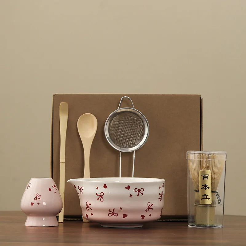 Hand-painted matcha tea set featuring a beautifully crafted bowl and whisk. The set showcases an elegant aesthetic with delicate floral designs in soft green and cream colors 6