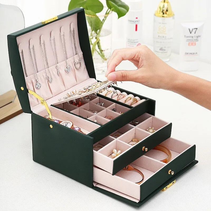Elegant jewelry box for women made of soft velvet, featuring three spacious drawers for organized storage. The rich burgundy color adds a touch of luxury, while 7