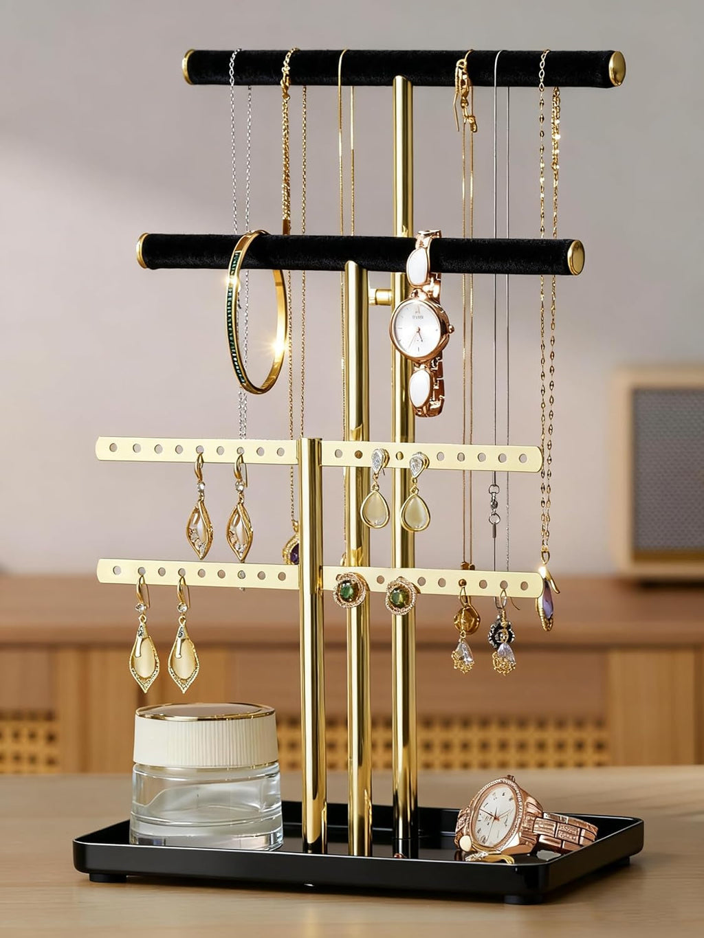 Elegant black and gold adjustable jewelry organizer stand made of soft velvet. It features multiple tiers for efficient storage, keeping necklaces, earrings, and rings neatly arranged 0