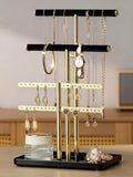 Elegant black and gold adjustable jewelry organizer stand made of soft velvet. It features multiple tiers for efficient storage, keeping necklaces, earrings, and rings neatly arranged 0