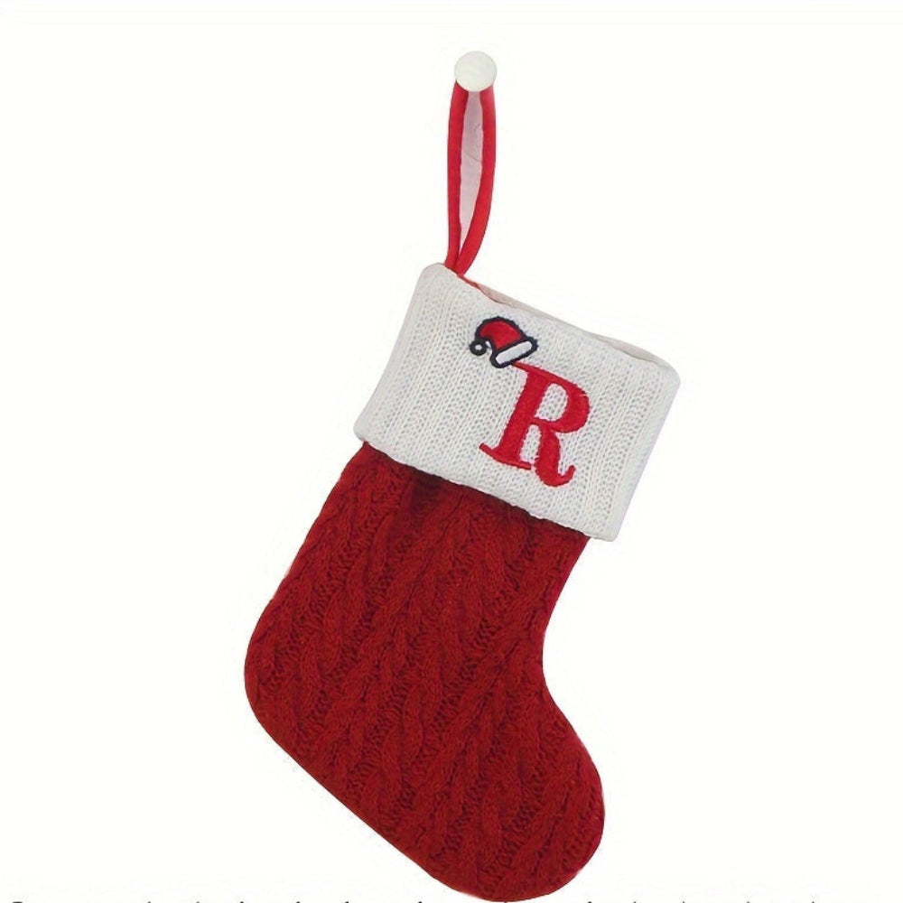 Knit monogram personalized Christmas stocking in festive red with white lettering. Classic knit texture adds warmth, perfect for holiday decor. Ideal for hanging by the 10
