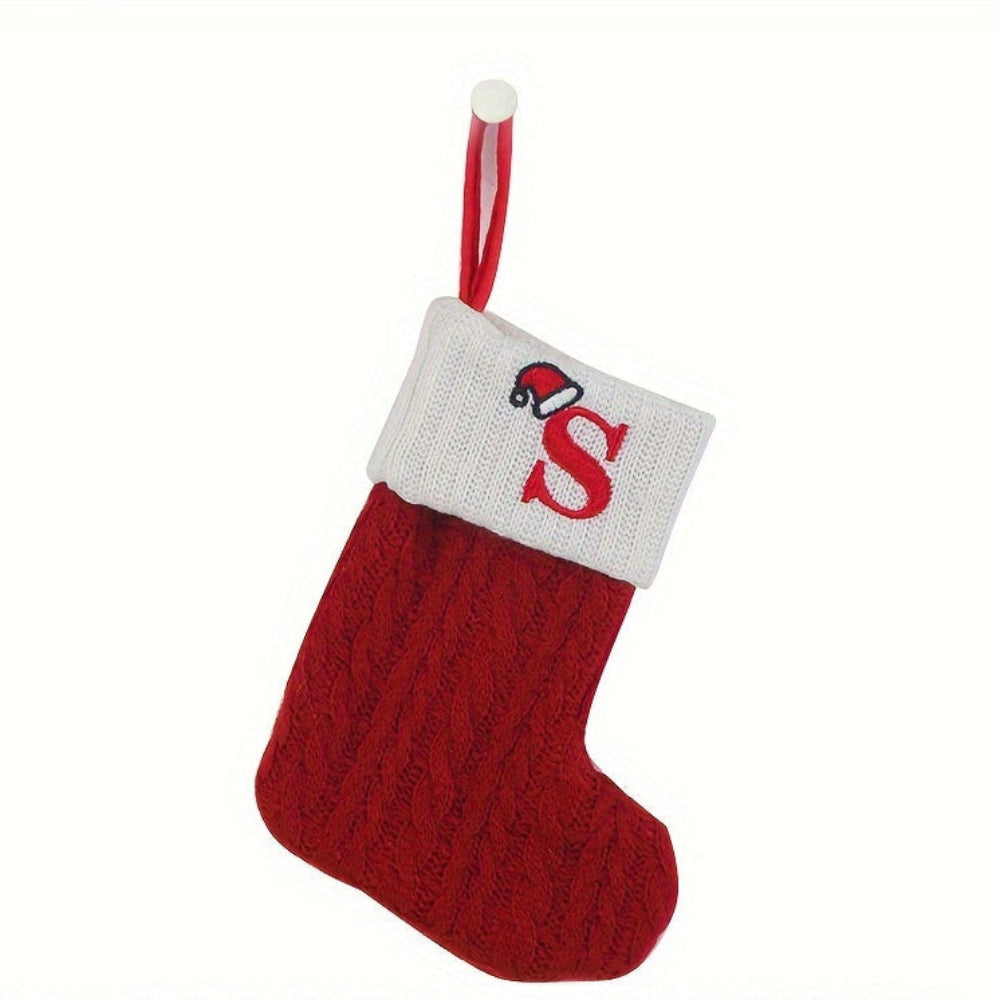 Knit monogram personalized Christmas stocking in festive red with white lettering. Classic knit texture adds warmth, perfect for holiday decor. Ideal for hanging by the 12