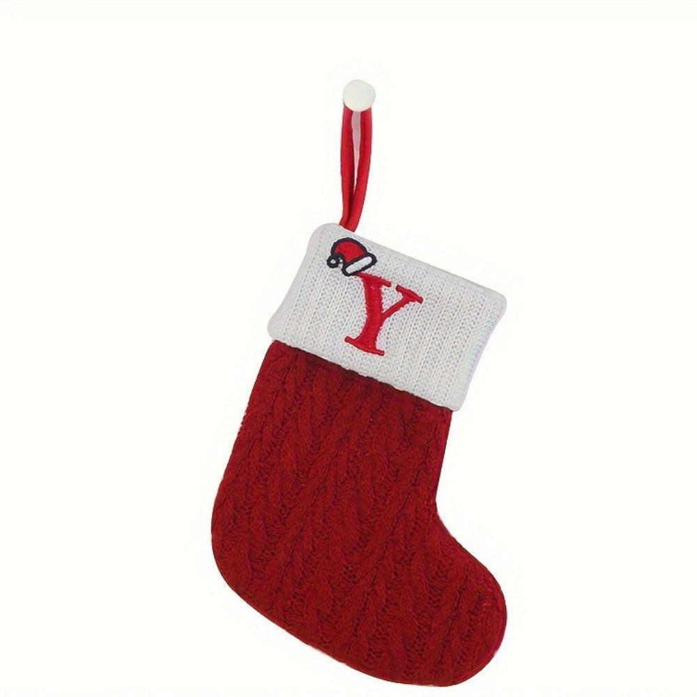 Knit monogram personalized Christmas stocking in festive red with white lettering. Classic knit texture adds warmth, perfect for holiday decor. Ideal for hanging by the 21