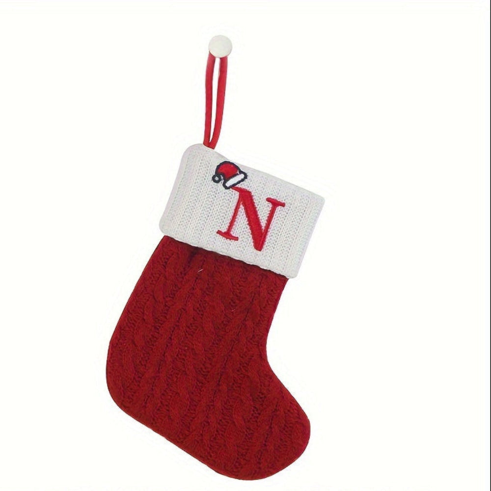 Knit monogram personalized Christmas stocking in festive red with white lettering. Classic knit texture adds warmth, perfect for holiday decor. Ideal for hanging by the 22