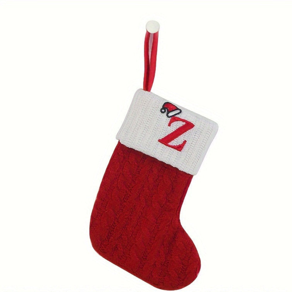 Knit monogram personalized Christmas stocking in festive red with white lettering. Classic knit texture adds warmth, perfect for holiday decor. Ideal for hanging by the 23
