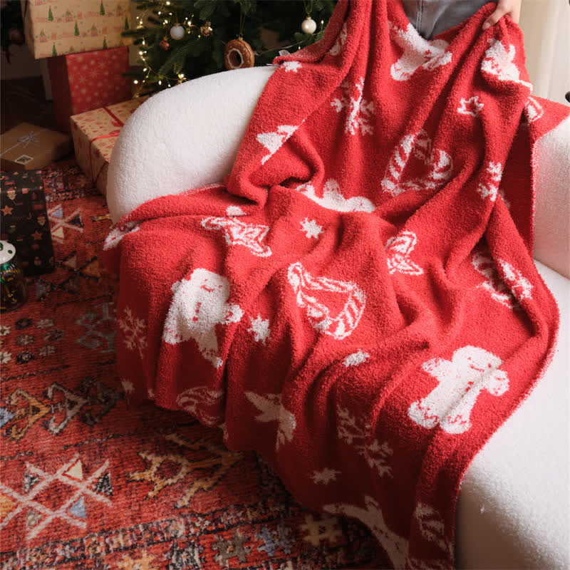 Cozy red and white knit throw blanket featuring a festive gingerbread man design, perfect for adding holiday cheer to your living space. Ideal for snuggling 0