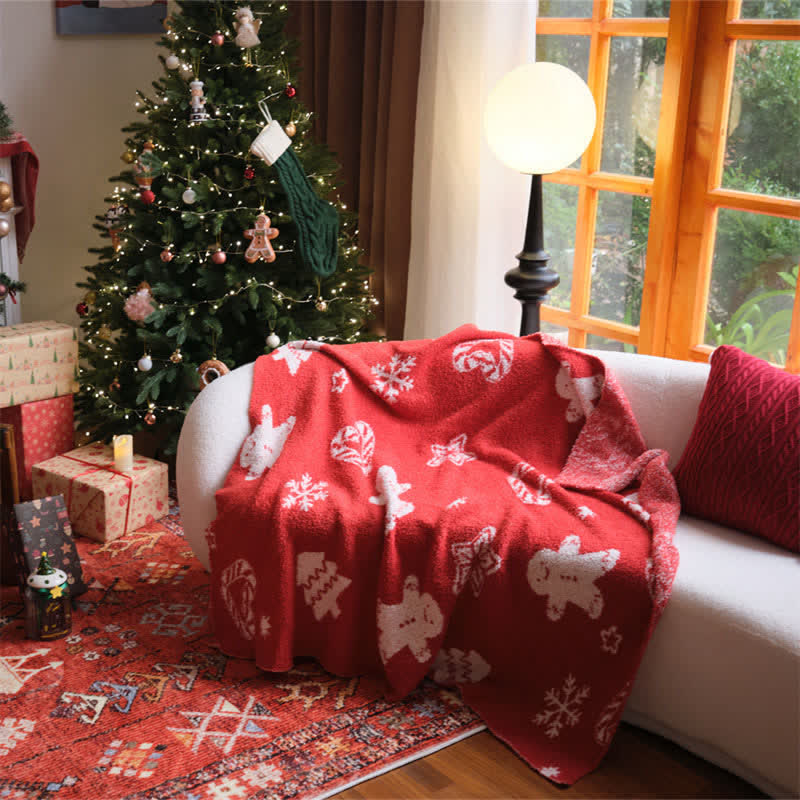 Cozy red and white knit throw blanket featuring a festive gingerbread man design, perfect for adding holiday cheer to your living space. Ideal for snuggling 1