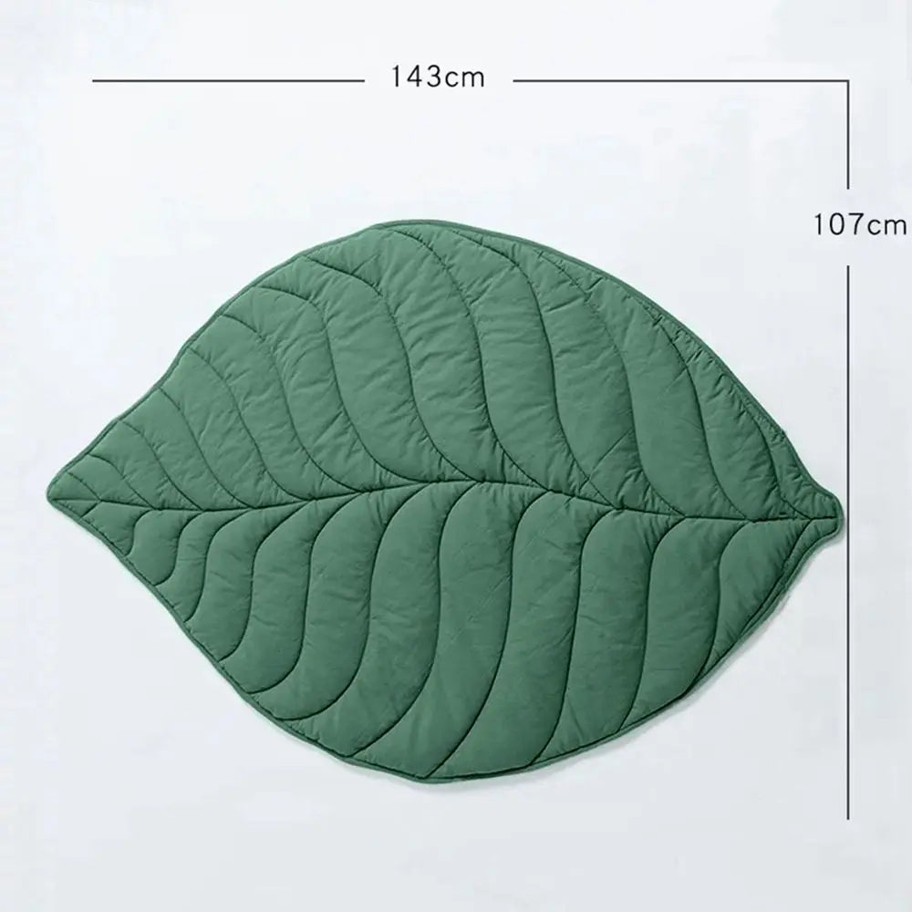 Leaf-shaped dog cooling mat in soft, breathable fabric. Features a washable design with a vibrant green color, mimicking natural leaves. Ideal for keeping pets 8