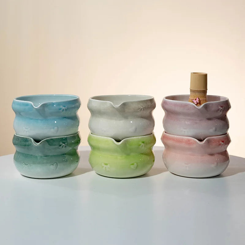 Elegant 7-piece matcha set featuring a beautifully crafted ceramic bowl and whisk, adorned with delicate cherry blossom designs. The set includes a bowl, whisk 1