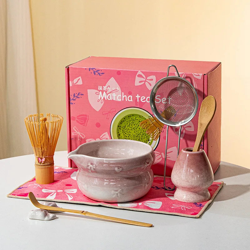 Elegant 7-piece matcha set featuring a beautifully crafted ceramic bowl and whisk, adorned with delicate cherry blossom designs. The set includes a bowl, whisk 10