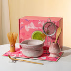 Elegant 7-piece matcha set featuring a beautifully crafted ceramic bowl and whisk, adorned with delicate cherry blossom designs. The set includes a bowl, whisk 10