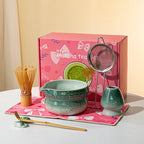 Elegant 7-piece matcha set featuring a beautifully crafted ceramic bowl and whisk, adorned with delicate cherry blossom designs. The set includes a bowl, whisk 21