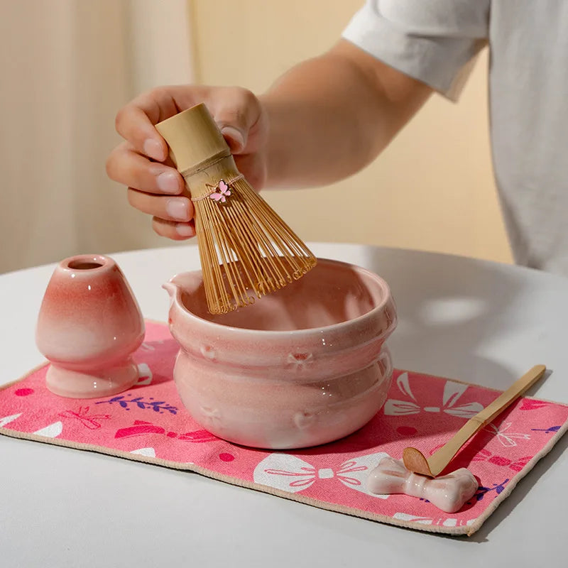 Elegant 7-piece matcha set featuring a beautifully crafted ceramic bowl and whisk, adorned with delicate cherry blossom designs. The set includes a bowl, whisk 3