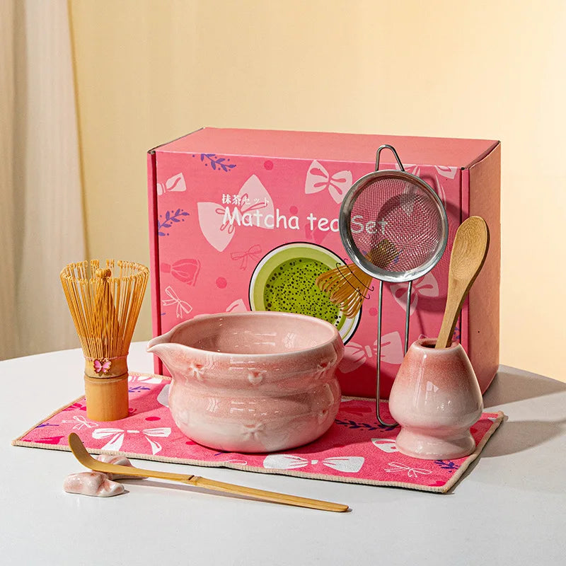 Elegant 7-piece matcha set featuring a beautifully crafted ceramic bowl and whisk, adorned with delicate cherry blossom designs. The set includes a bowl, whisk 6