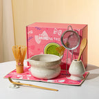 Elegant 7-piece matcha set featuring a beautifully crafted ceramic bowl and whisk, adorned with delicate cherry blossom designs. The set includes a bowl, whisk 7