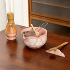 Elegant 8-piece matcha tea set featuring a delicate cherry blossom bowl. Includes a matcha whisk, scoop, and sifter, all crafted from 1