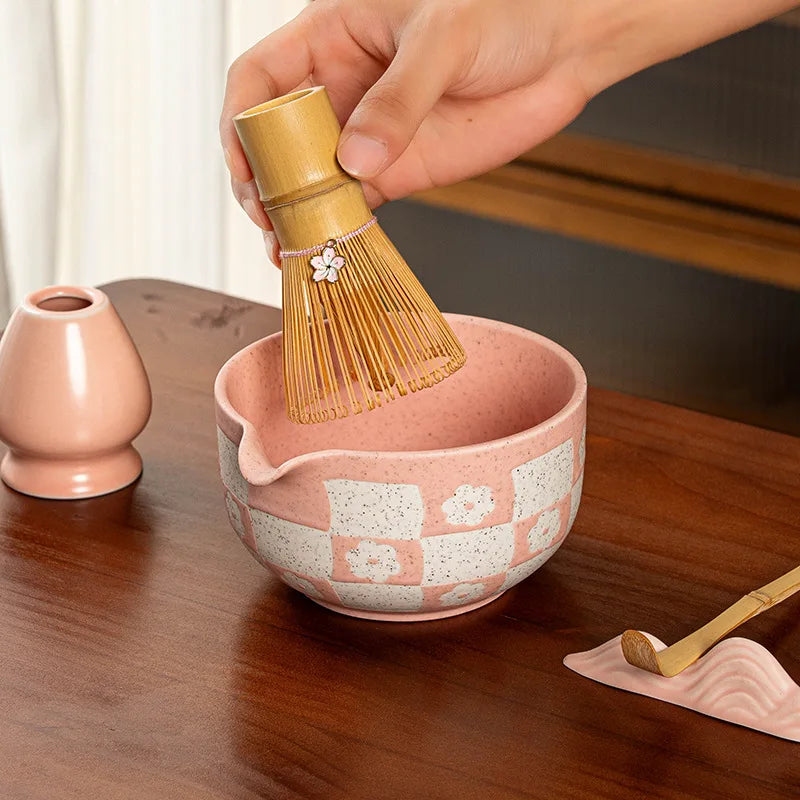 Elegant 8-piece matcha tea set featuring a delicate cherry blossom bowl. Includes a matcha whisk, scoop, and sifter, all crafted from 2
