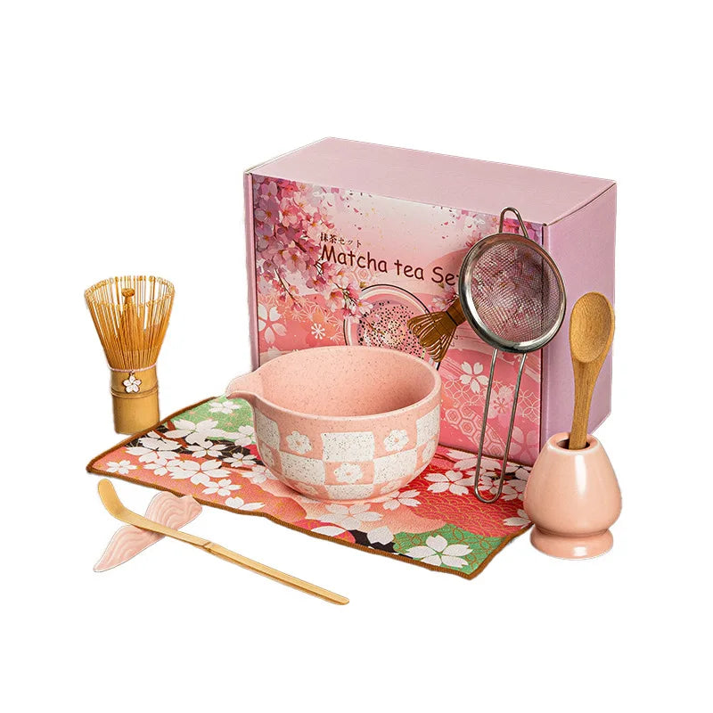 Elegant 8-piece matcha tea set featuring a delicate cherry blossom bowl. Includes a matcha whisk, scoop, and sifter, all crafted from 4