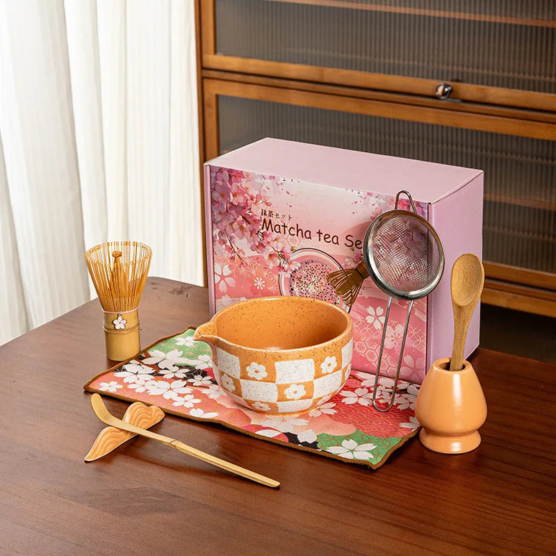 Elegant 8-piece matcha tea set featuring a delicate cherry blossom bowl. Includes a matcha whisk, scoop, and sifter, all crafted from 9