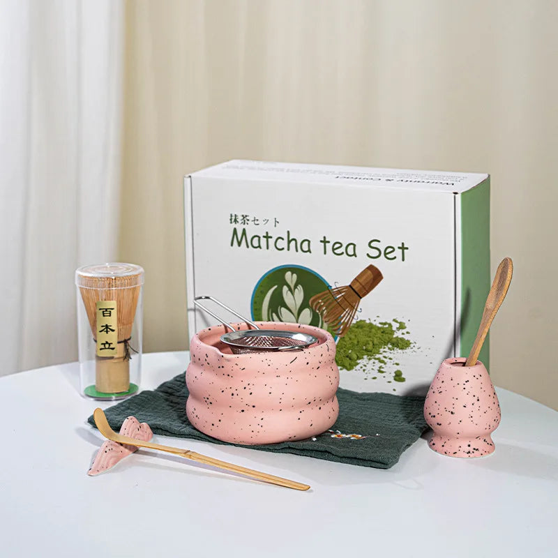 Elegant matcha tea set featuring a handmade ceramic bowl in a soft green hue, accompanied by a traditional bamboo whisk, perfect for tea enthusiasts and makes a 0