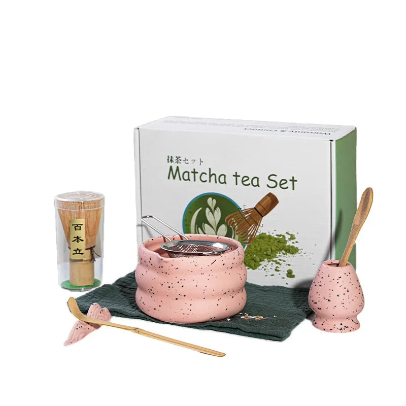 Elegant matcha tea set featuring a handmade ceramic bowl in a soft green hue, accompanied by a traditional bamboo whisk, perfect for tea enthusiasts and makes a 5