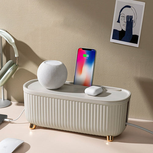 Sleek minimalist cable management storage box in matte white plastic, featuring a spacious interior for organizing cords and chargers, with discreet openings for easy access and 2