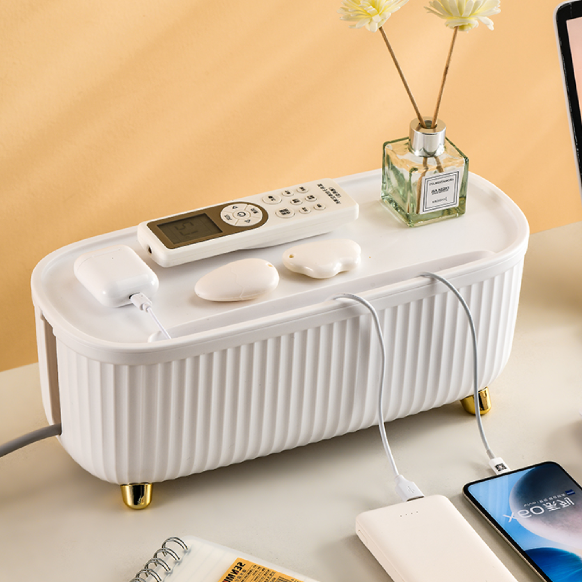 Sleek modern cable management storage box in a minimalist design. Made from durable plastic, it features a clean white finish, perfect for organizing wires and 5