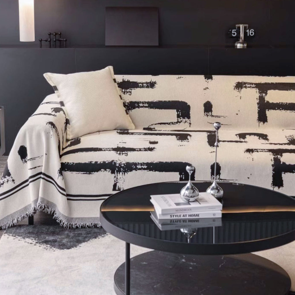 Soft monochrome sofa cover made from breathable, pet-friendly fabric. Designed to protect and enhance your couch, it features a sleek, modern look that fits 1