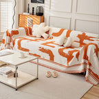 Soft monochrome sofa cover made from breathable, pet-friendly fabric. Designed to protect and enhance your couch, it features a sleek, modern look that fits 12