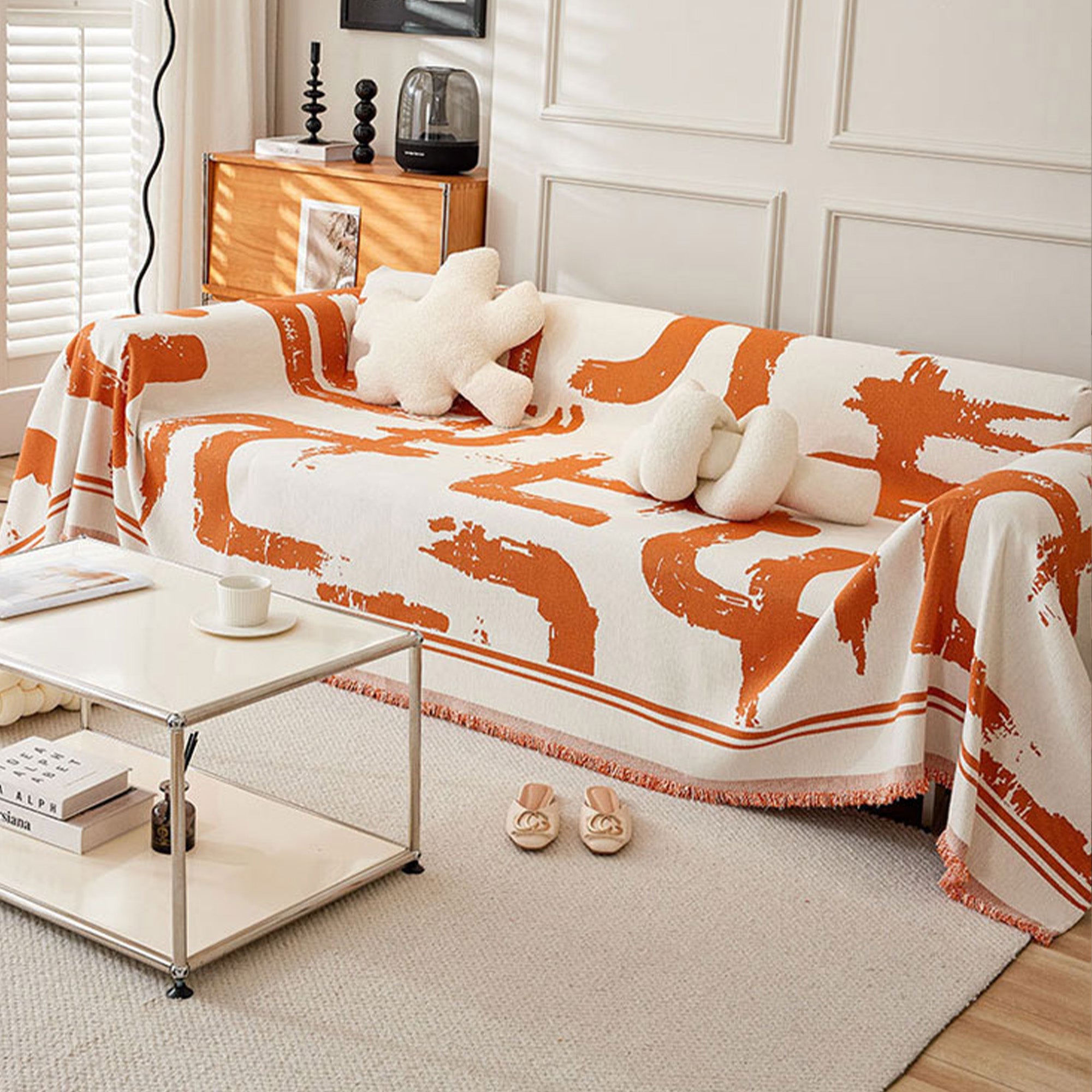 Soft monochrome sofa cover made from breathable, pet-friendly fabric. Designed to protect and enhance your couch, it features a sleek, modern look that fits 12