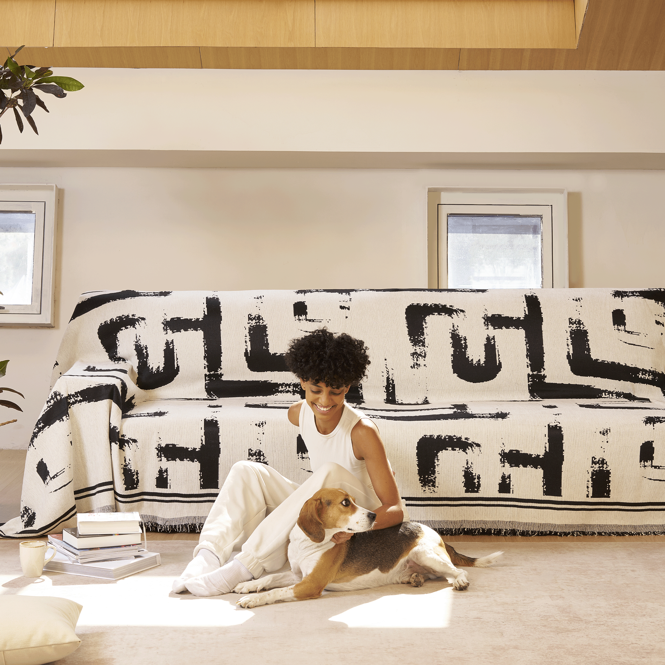 Soft monochrome sofa cover made from breathable, pet-friendly fabric. Designed to protect and enhance your couch, it features a sleek, modern look that fits 2