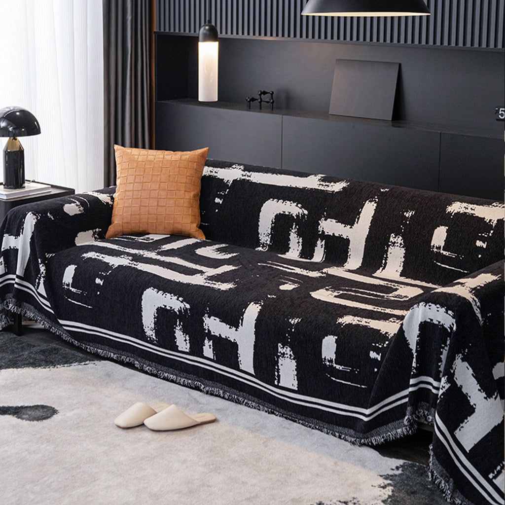 Soft monochrome sofa cover made from breathable, pet-friendly fabric. Designed to protect and enhance your couch, it features a sleek, modern look that fits 3
