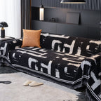 Soft monochrome sofa cover made from breathable, pet-friendly fabric. Designed to protect and enhance your couch, it features a sleek, modern look that fits 3