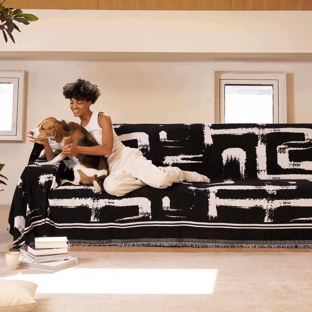 Soft monochrome sofa cover made from breathable, pet-friendly fabric. Designed to protect and enhance your couch, it features a sleek, modern look that fits 4