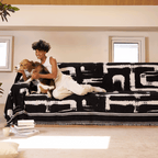 Soft monochrome sofa cover made from breathable, pet-friendly fabric. Designed to protect and enhance your couch, it features a sleek, modern look that fits 4