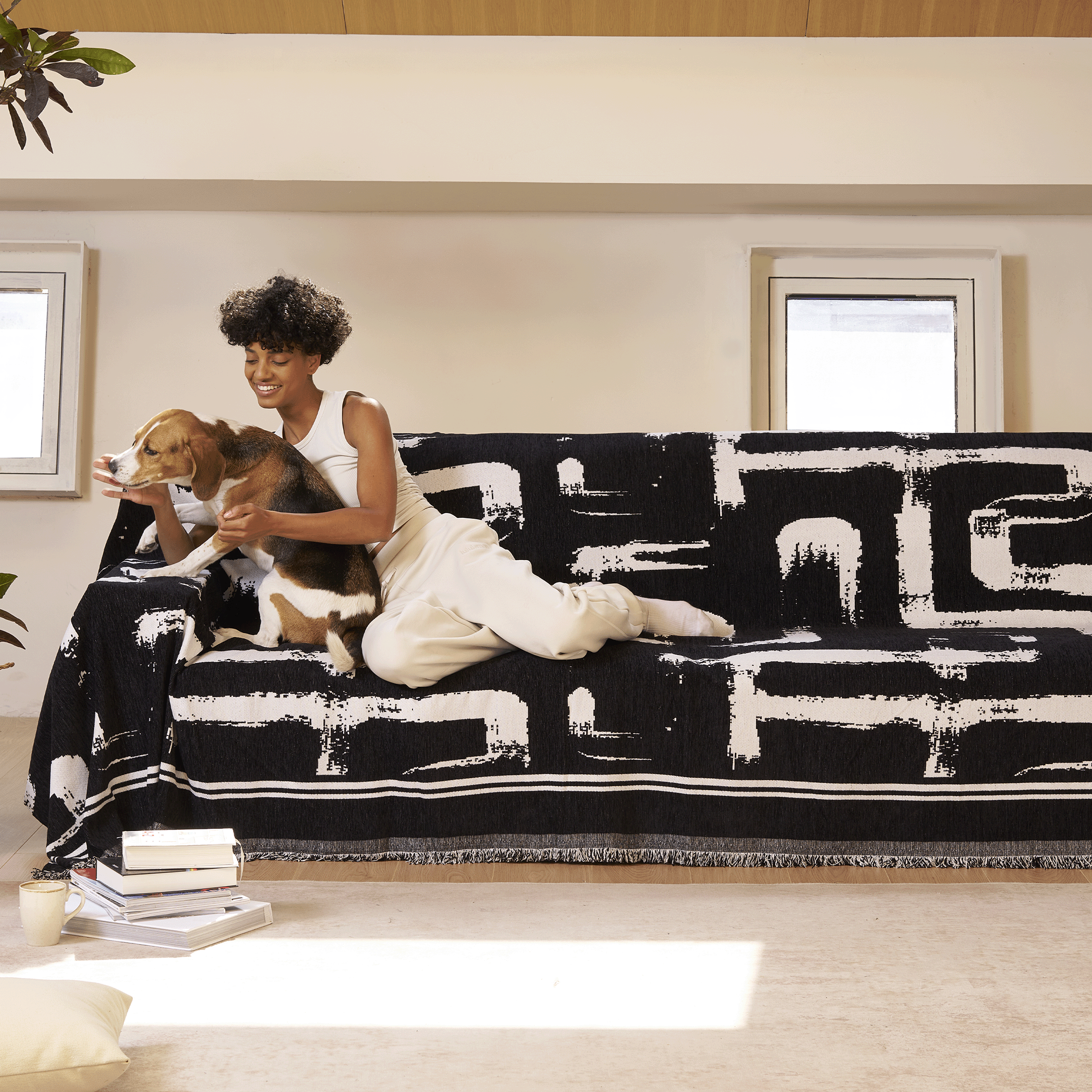 Soft monochrome sofa cover made from breathable, pet-friendly fabric. Designed to protect and enhance your couch, it features a sleek, modern look that fits 4