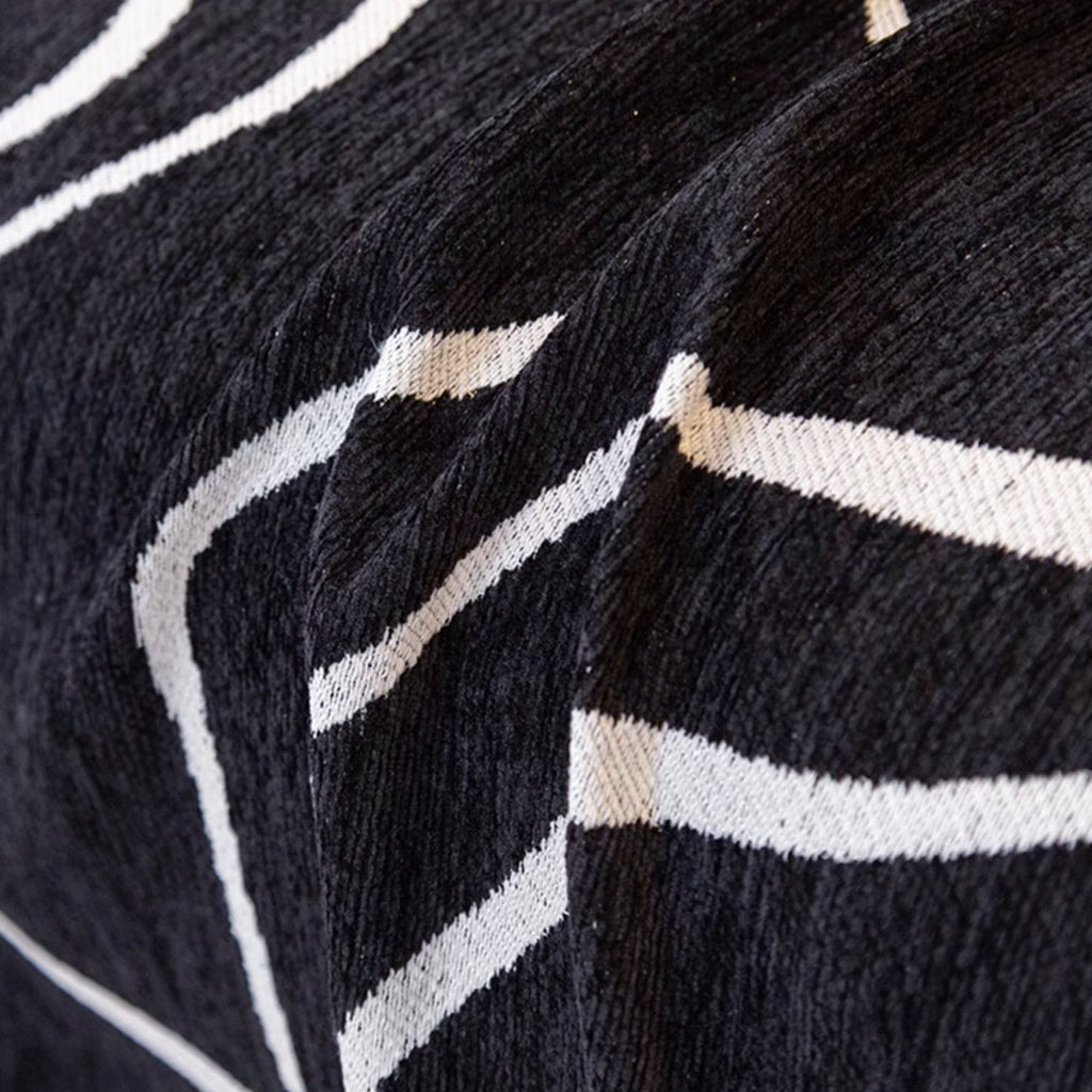 Soft monochrome sofa cover made from breathable, pet-friendly fabric. Designed to protect and enhance your couch, it features a sleek, modern look that fits 8