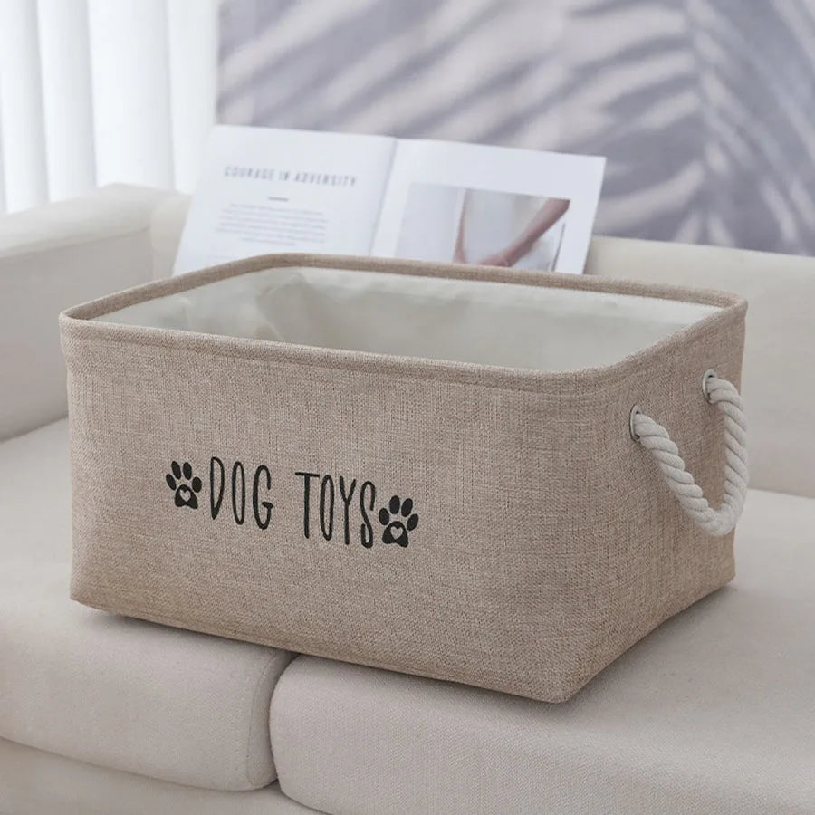 Natural beige woven storage basket, designed for multi-purpose use as a laundry hamper. Features durable fabric with a textured finish, perfect for organizing items while adding 0