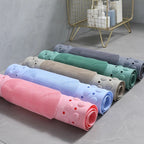 Non-slip shower bath mat in soft blue with built-in foot scrubber for enhanced safety and comfort. Made from durable, quick-drying materials, it 7