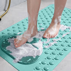Non-slip shower bath mat in soft gray with built-in foot scrubber for added safety. Made from durable, quick-drying material, it features a 8