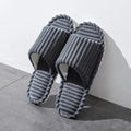 Open slippers featuring a striped design, made from breathable cotton material for comfort. Ideal for indoor wear, these slippers come in a soft color palette, ensuring 0