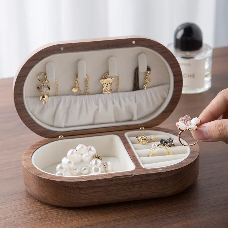 Oval mini wooden jewellery box featuring a luxurious velvet lining, ideal for organizing accessories. The natural wood finish complements any decor, while its compact size makes it 4